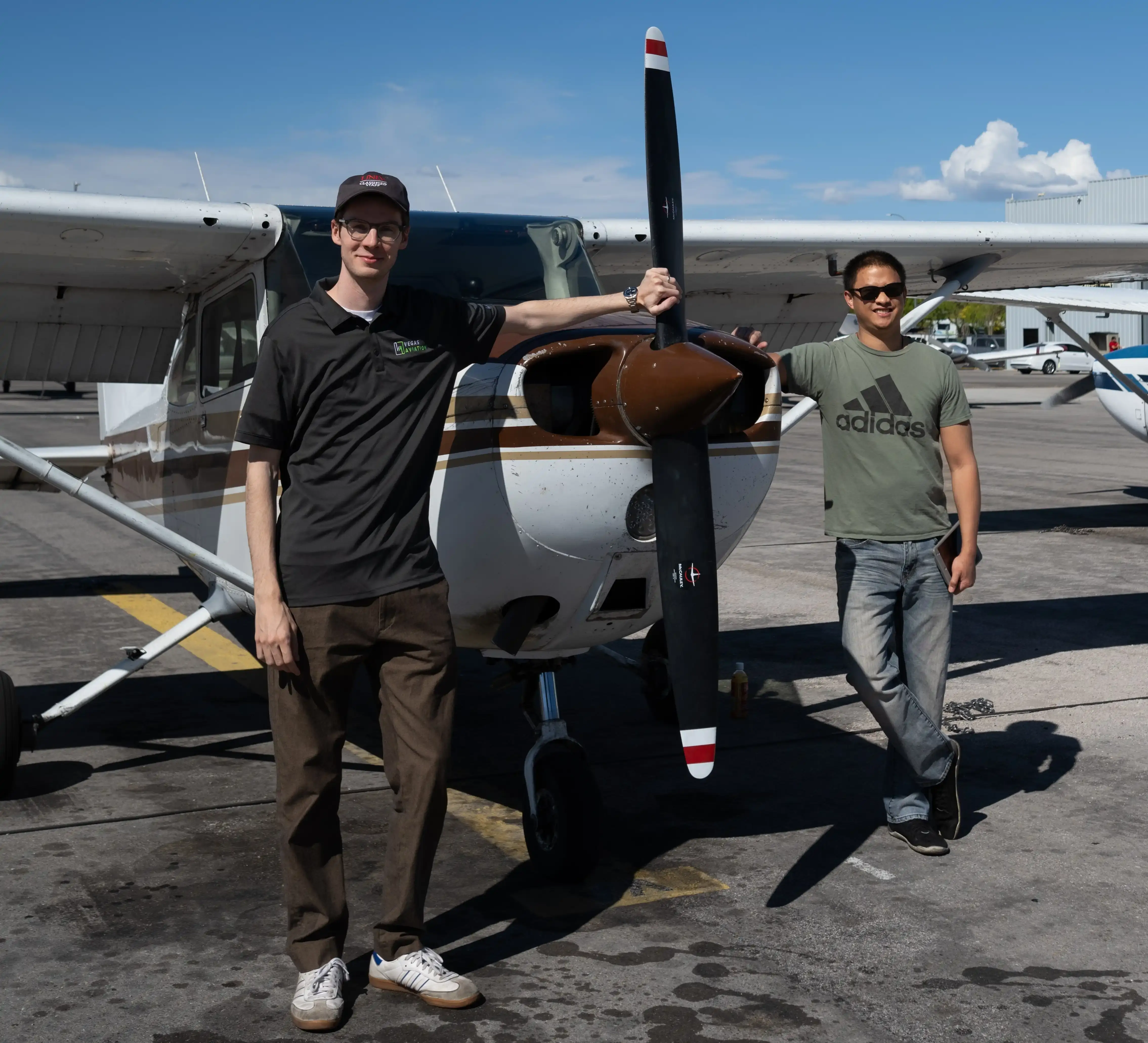 CFI and student in front of a plane