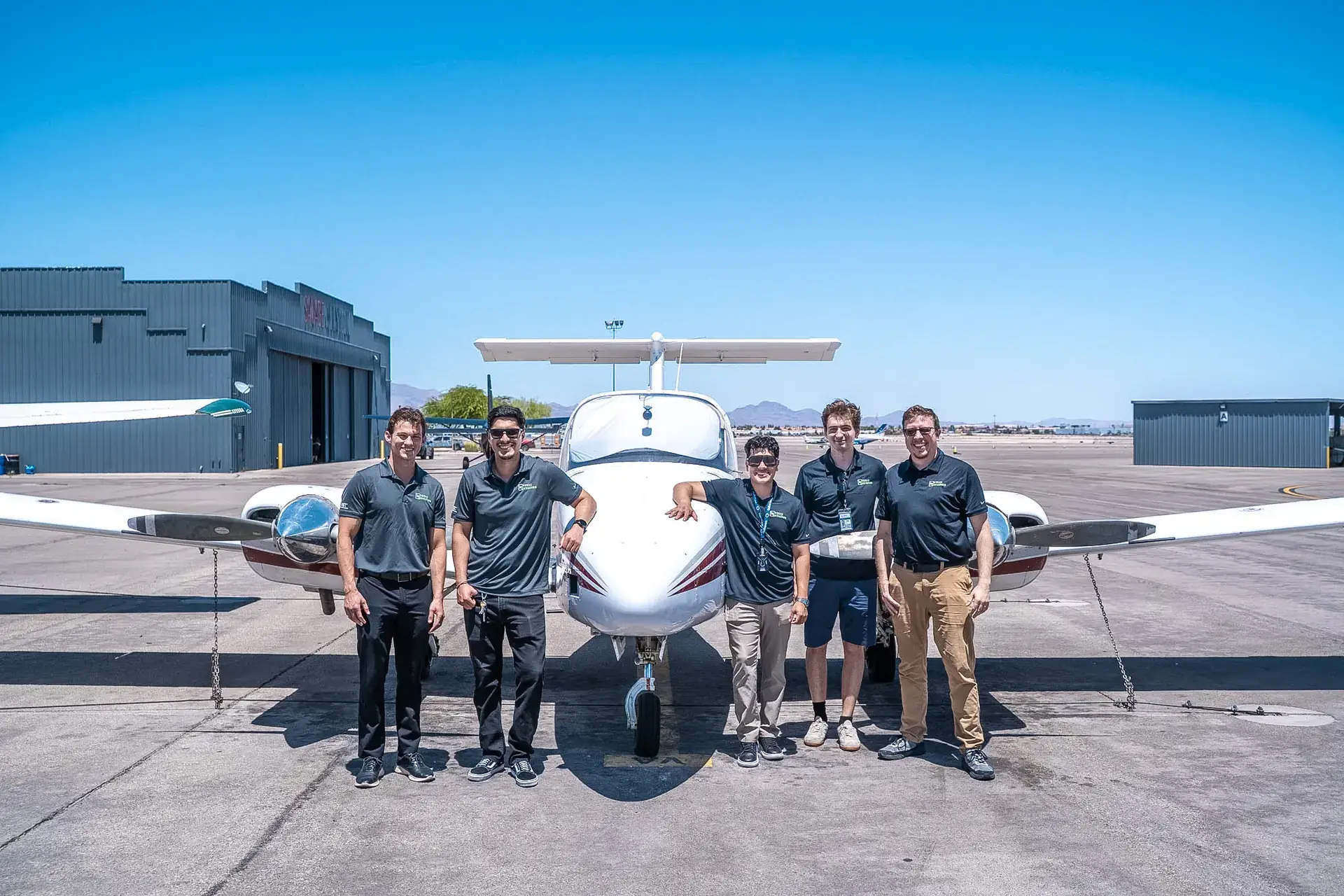 Vegas Aviation Certified Flight Instructors in front of Beechcraft Duchess aircraft