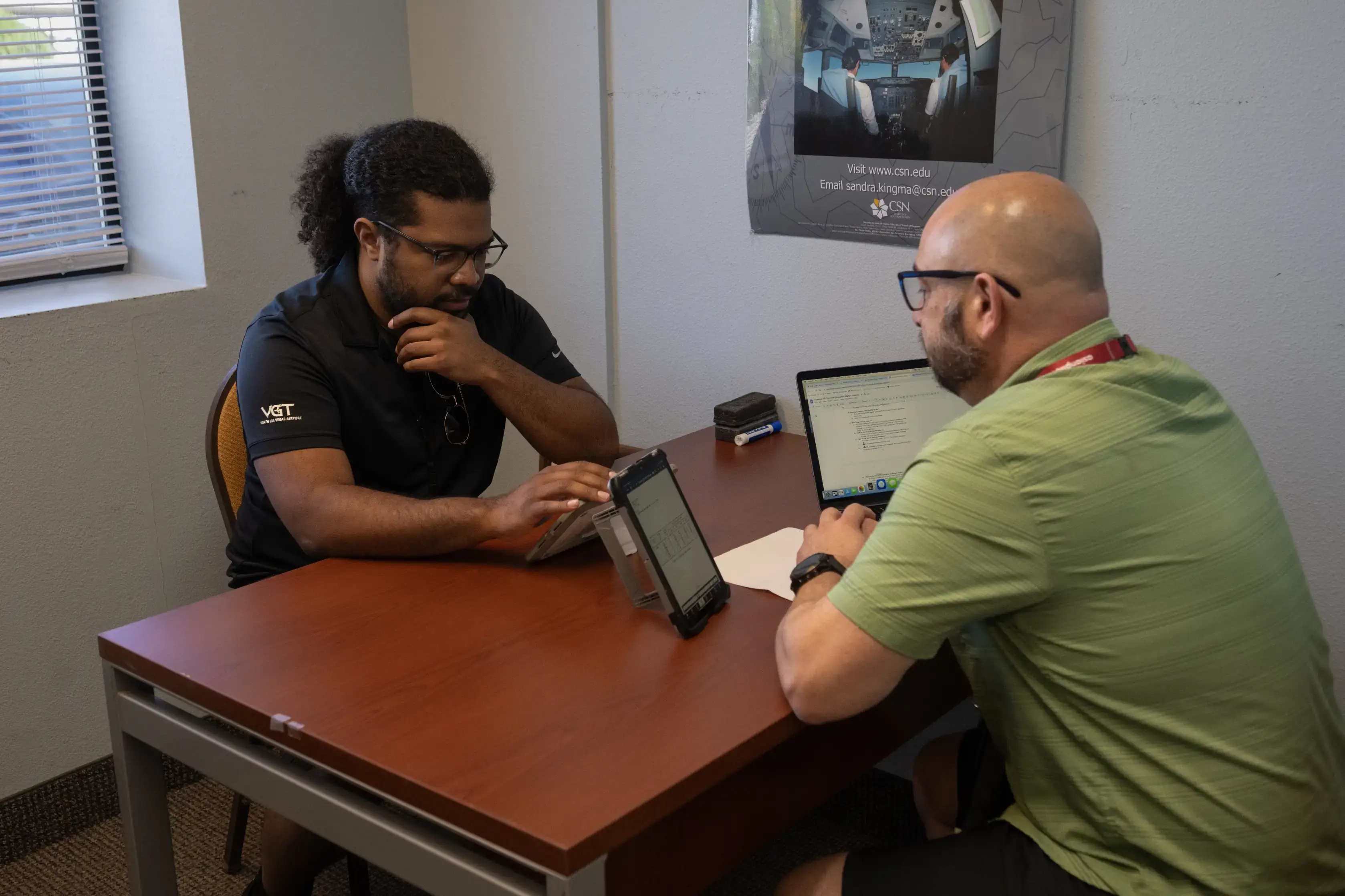 Certified Flight Instructor with student on a indoors lesson