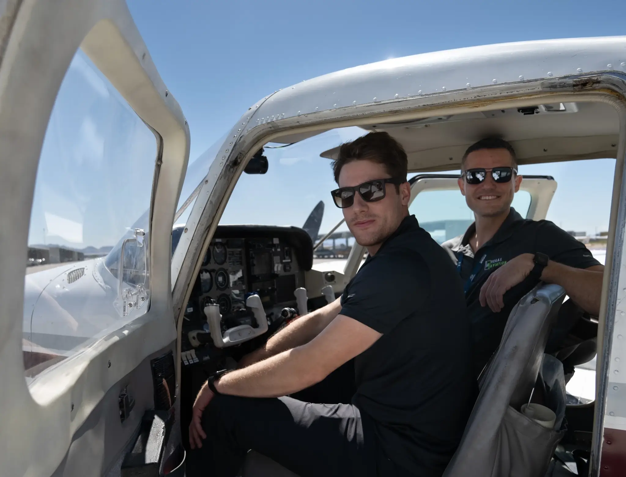 Outside view of two pilots in the cockpit